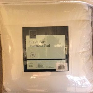 Never opened California King Mattress pad.